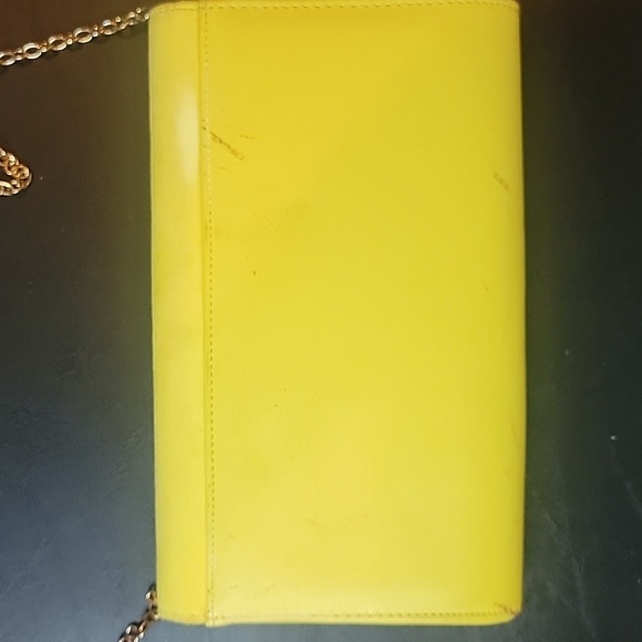 Aldo Yellow Clutch some spots.  Has a snap closure and chain shoulder strap - Picture 4 of 8